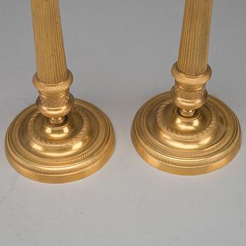 A pair of Empire bronze candlesticks, first half of the 19th century.