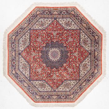 An Oktagonal  silk Qum rug, Central Persia, signed, c. 250 x 250 cm.