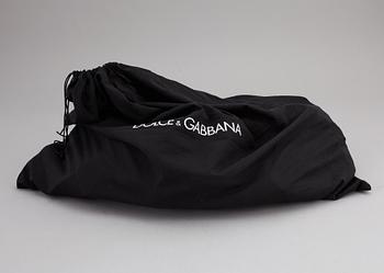 DOLCE & GABBANA, a black leather weekend bag, 2009.