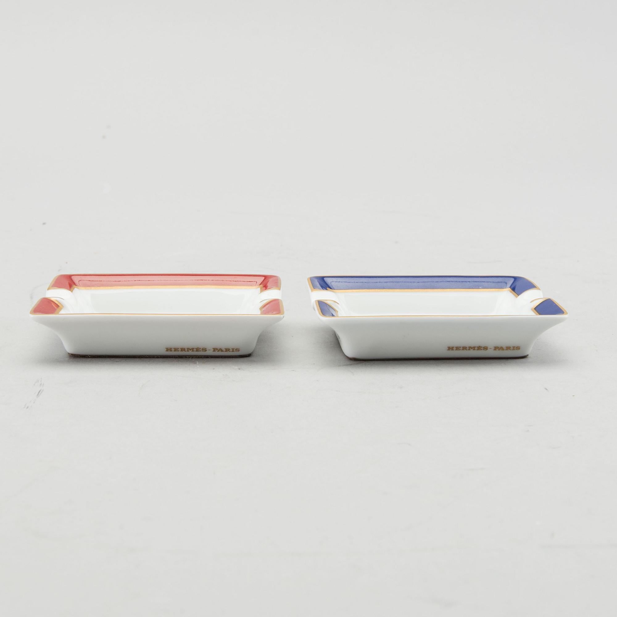 HERMÈS, a pair of porcelain ashtrays.