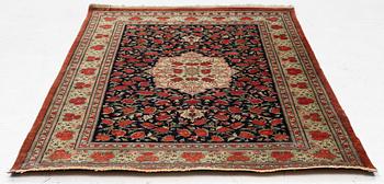 A signed silk Qum rug. c. 154 x 103 cm.