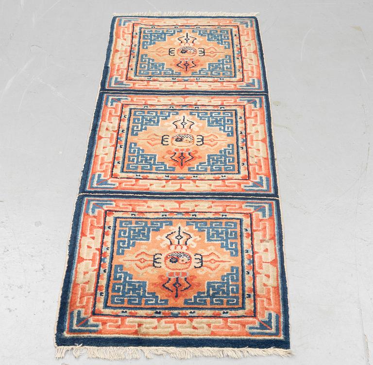 A semi antique chinese meditation rug, ca 159,5 x 57 cm.
