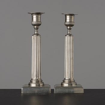 A pair of Gustavian white metal candlesticks by Isak Gråsten (1770-1821), Wedevågs Bruk.