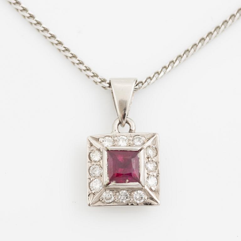 Pendant with chain in 18K white gold featuring a red stone, likely a ruby, and diamonds.