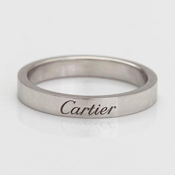 Cartier, a "C de Cartier" platinum ring.