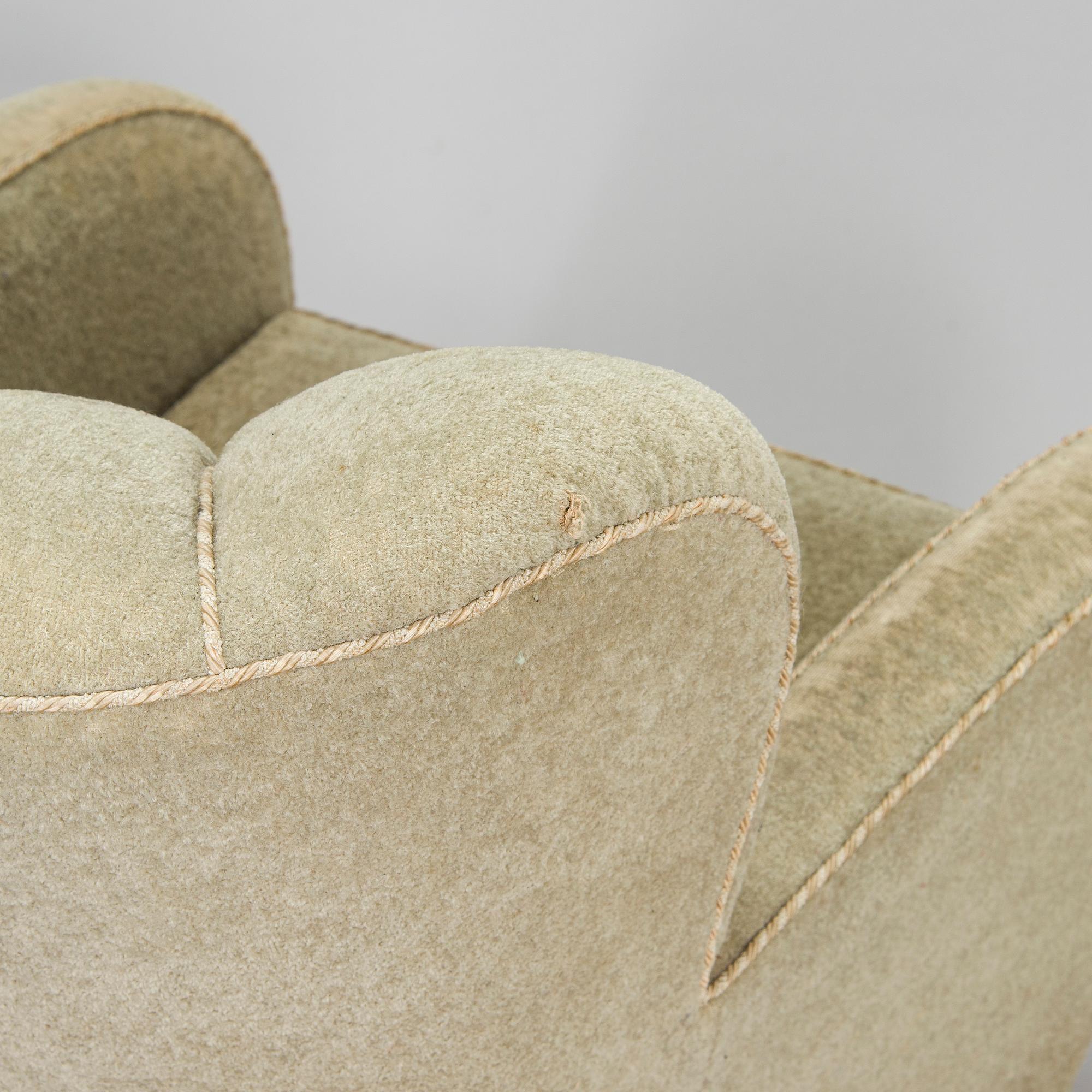 A pair of mid-20th century armchairs.