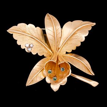 183. BROOCH, set with small diamonds and emeralds. Weight 32 g.