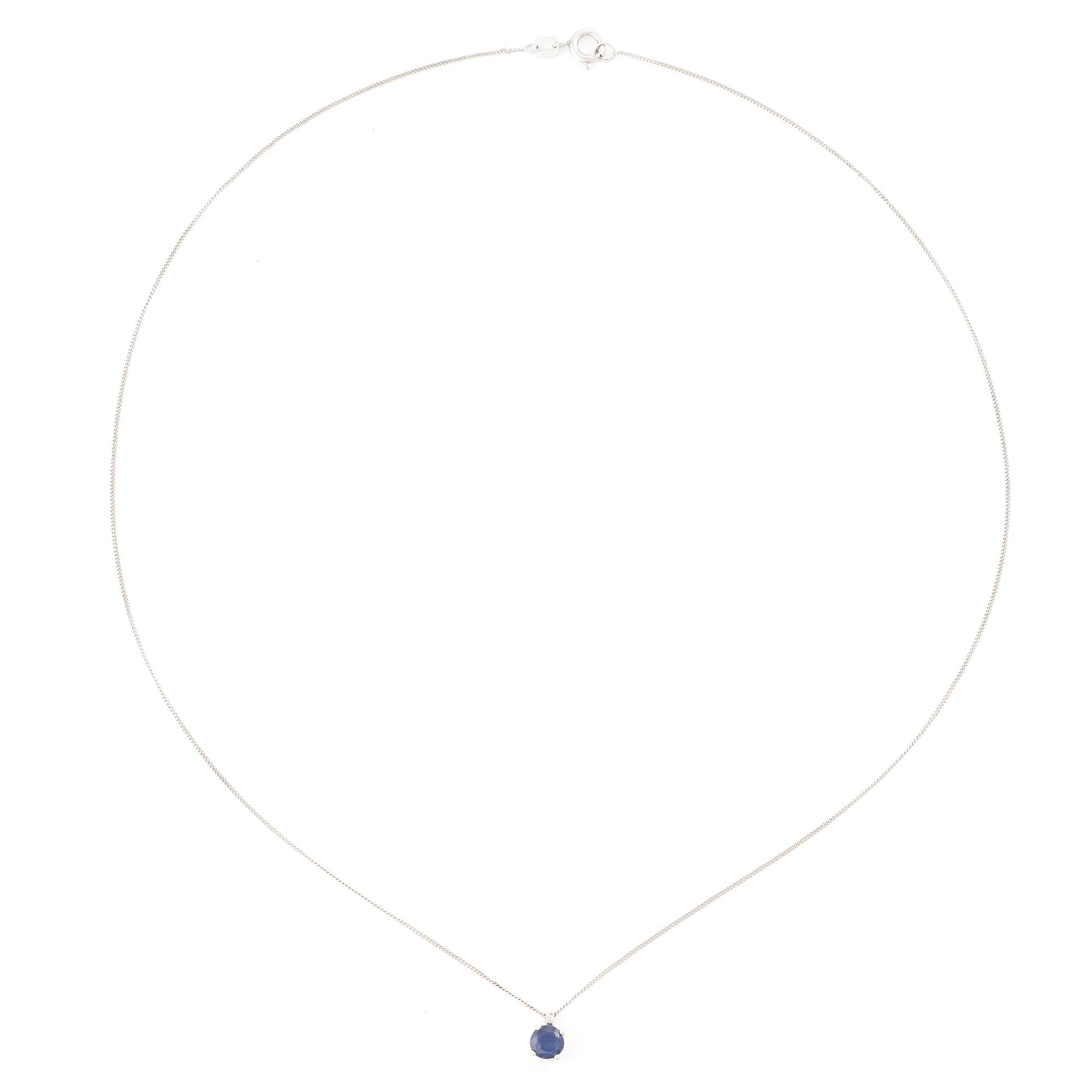 14K white gold necklace with a faceted sapphire.