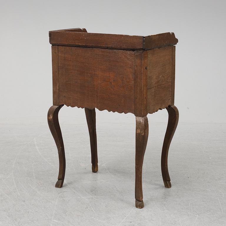 A mid 18th Century oak rococo bedside table.