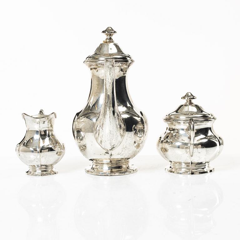 A silver coffee pot, cream jug and sugar bowl, Swedish import mark of CG Hallberg, Stockholm 1927.