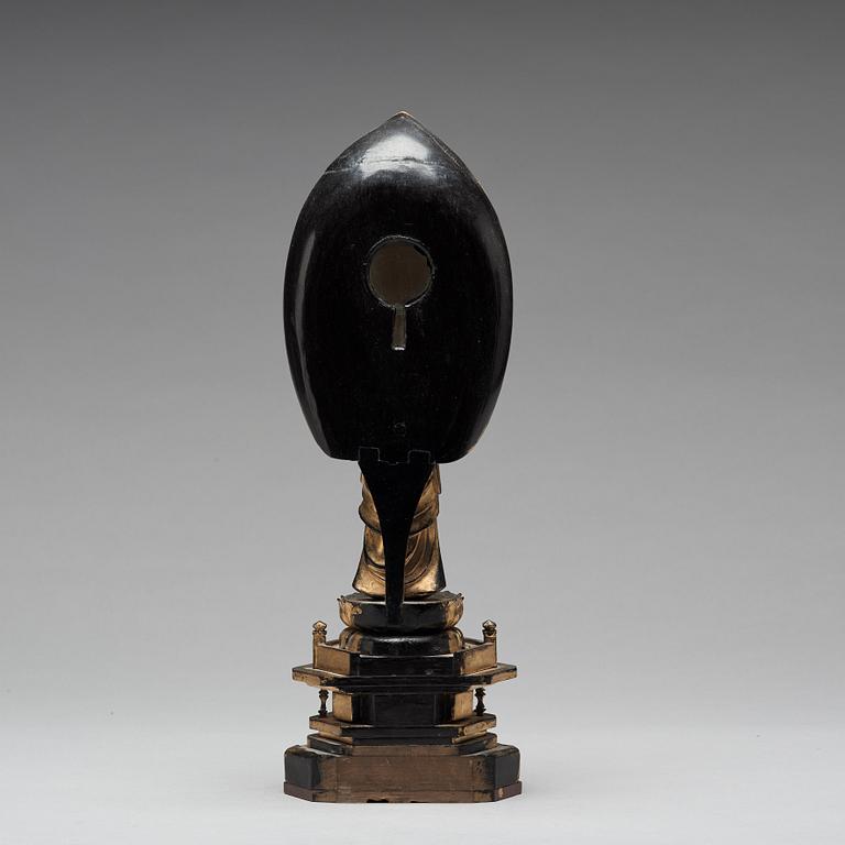 A Japanese gilt and lacquered wooden figure of Buddha and a travel shrine, Edo Period, 19th century.