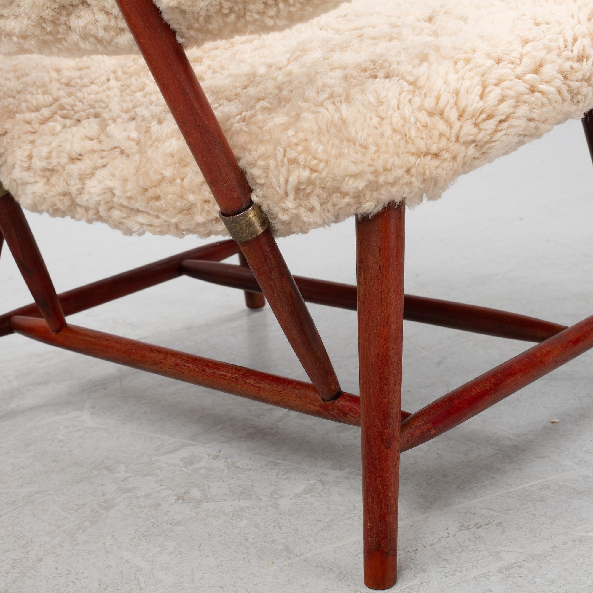 Alf Svensson, a pair of 'TeVe' easy chairs with new sheepskin upholstery, 1950s.