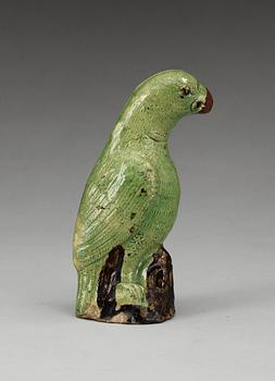 A green glazed figure of a bird, late Qing dynasty.