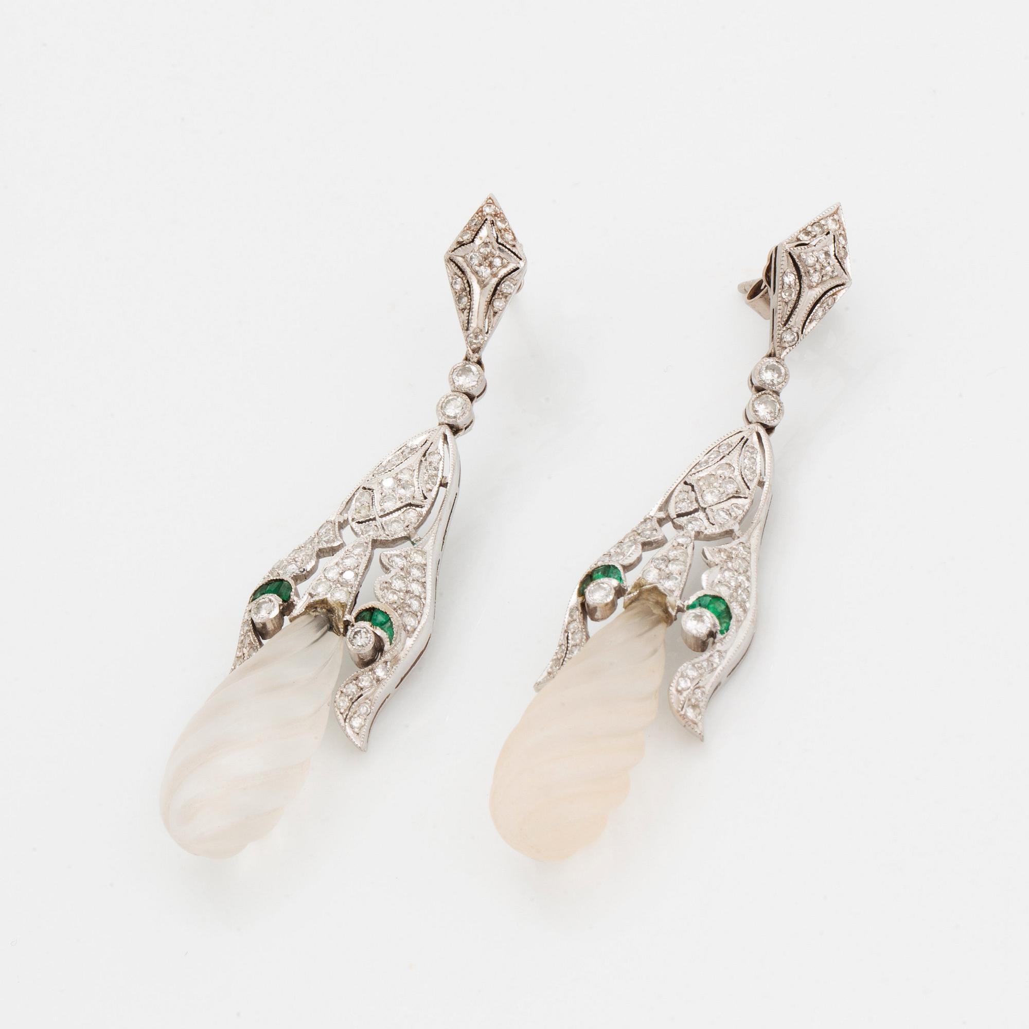 A pair of 18K white gold earrings with rock crystal drops.