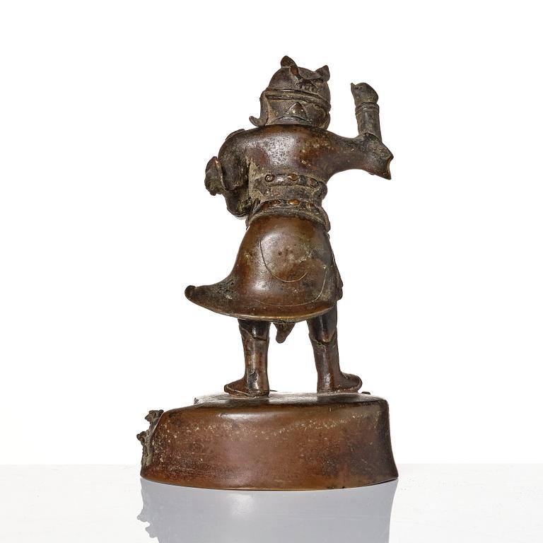A bronze sculpture of a man with a tablet, Ming dynasty (1368-1644).