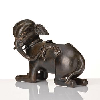 A bronze figure/censer of a reclining elephant, Qing dynasty, 19th Century.