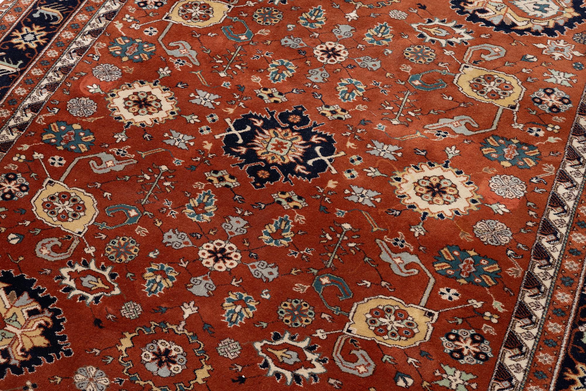 A semi-antique Orientall carpet c. 318 x 202 cm.