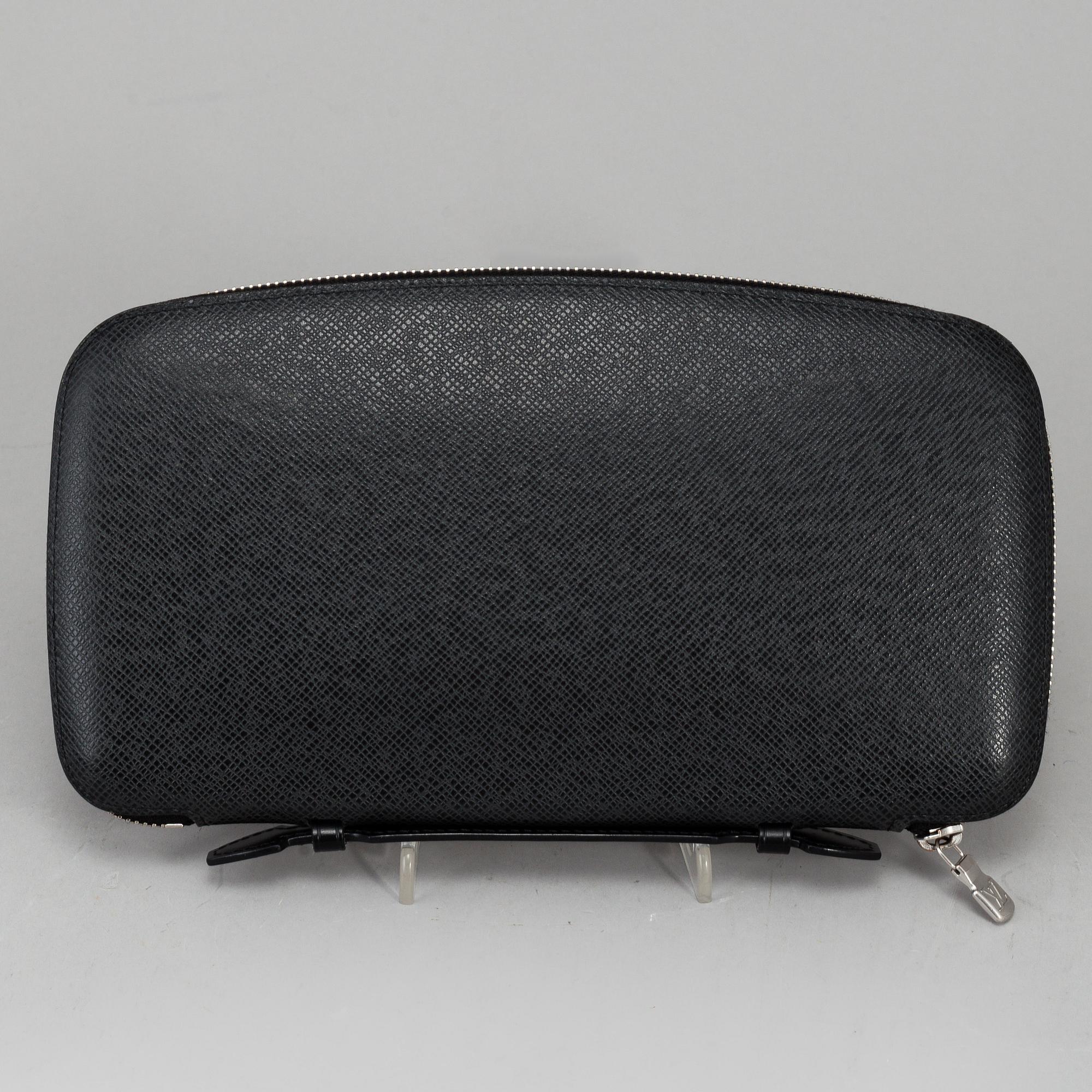 LOUIS VUITTON, an 'Atoll Ardiose' Taiga leather trave organizer, 2015.