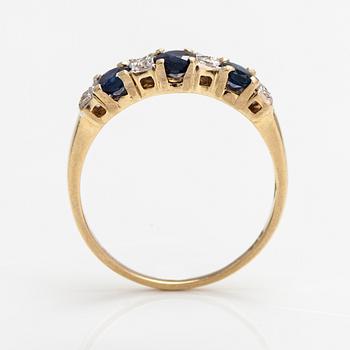 A 14K gold ring with diamonds ca. 0.05 ct and sapphires. Finnish import marks 1990.