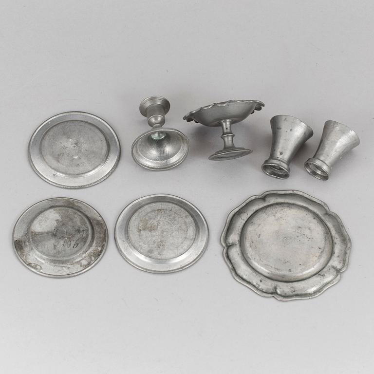 A lot of eight pewter doll house accessories 19th century.