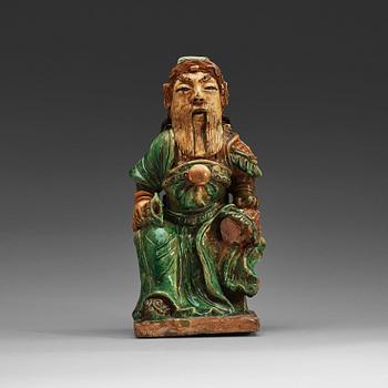 12. A green and yellow glazed roof tile figure of a warrior, Ming dynasty (1368-1644).