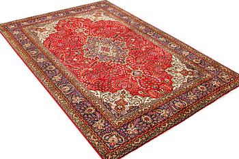 A Tabriz carpet, c 295 x 198 cm.