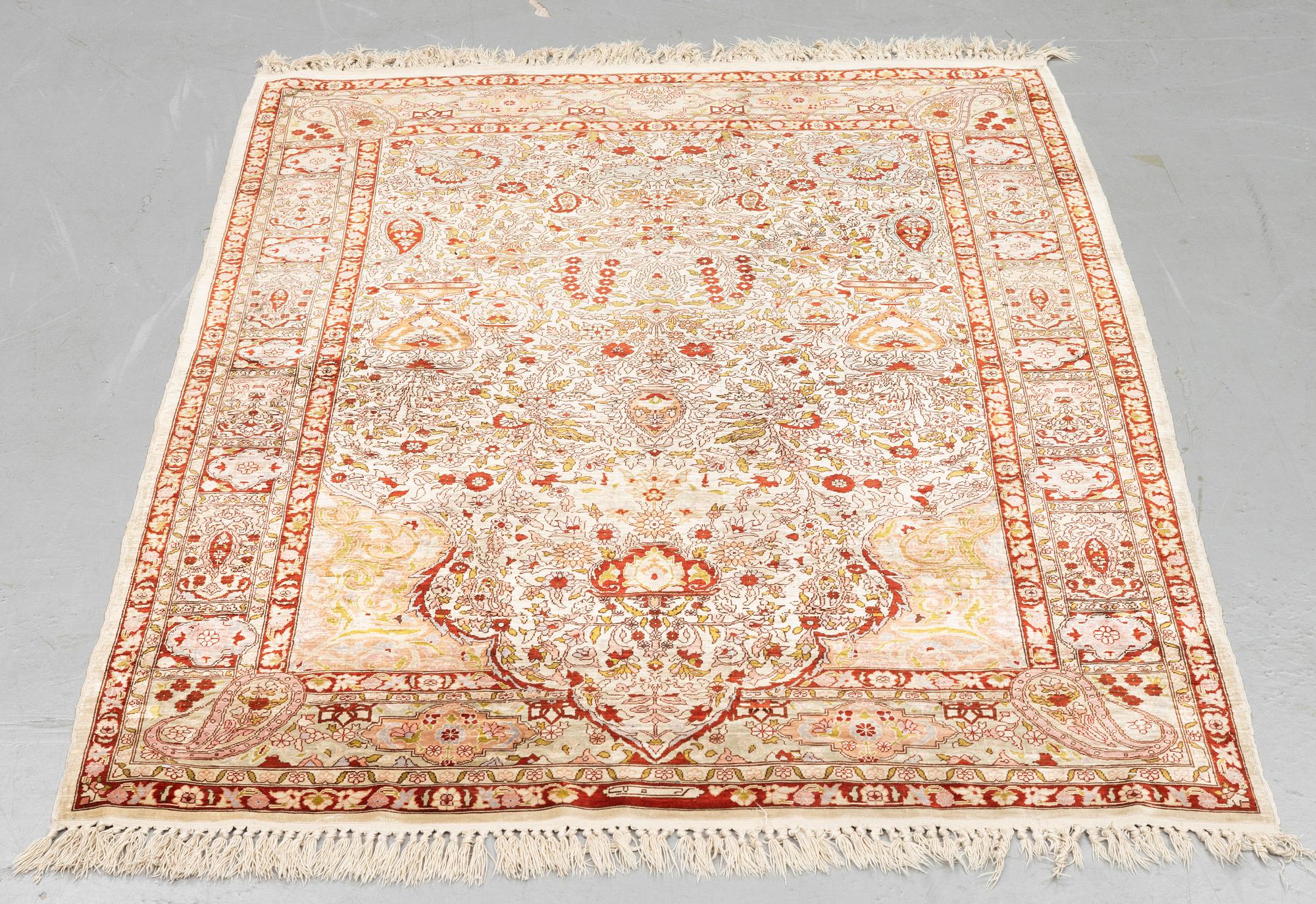 A rug, Old silk Hereke, ca 152 x 110 cm.