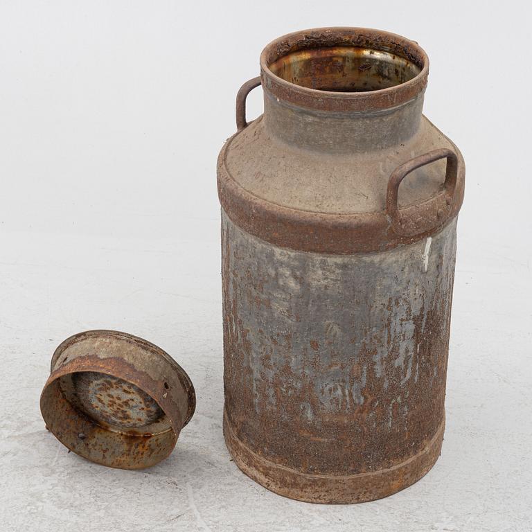 A milk pail, numbered 1803.