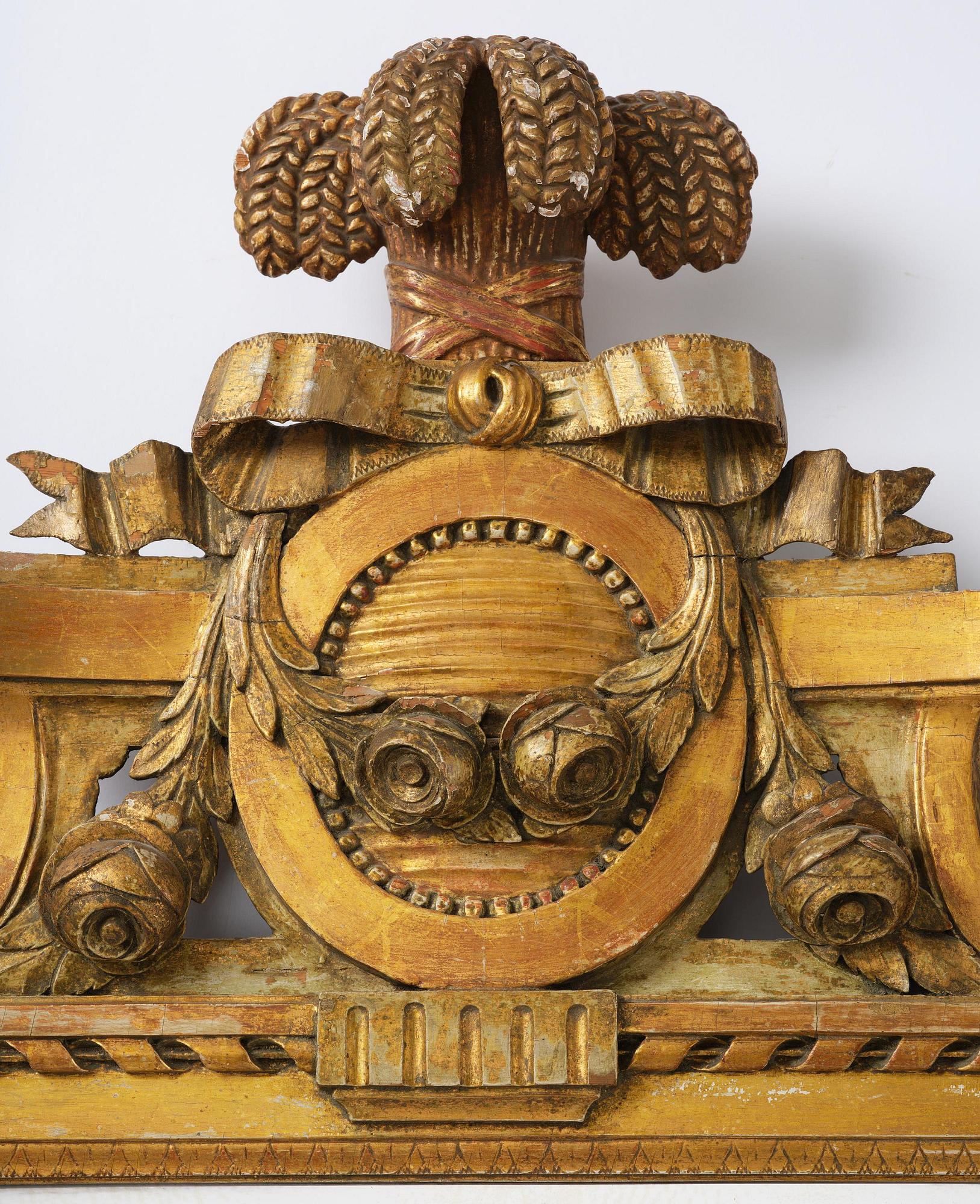 A Gustavian giltwood mirror by C. G. Fyrwald (master in Stockholm 1776-1825).