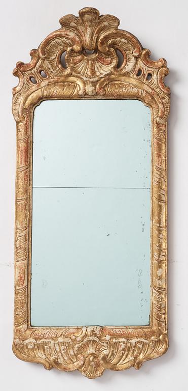 A Swedish gitlwood rococo mirror, Stockholm, later part 18th century.