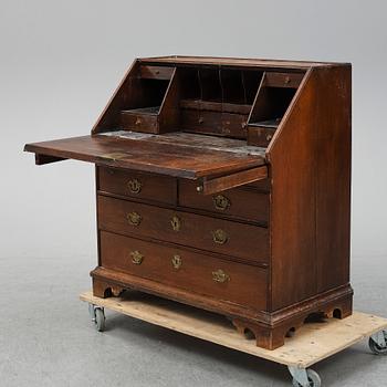 An early 19th century oak secratire.