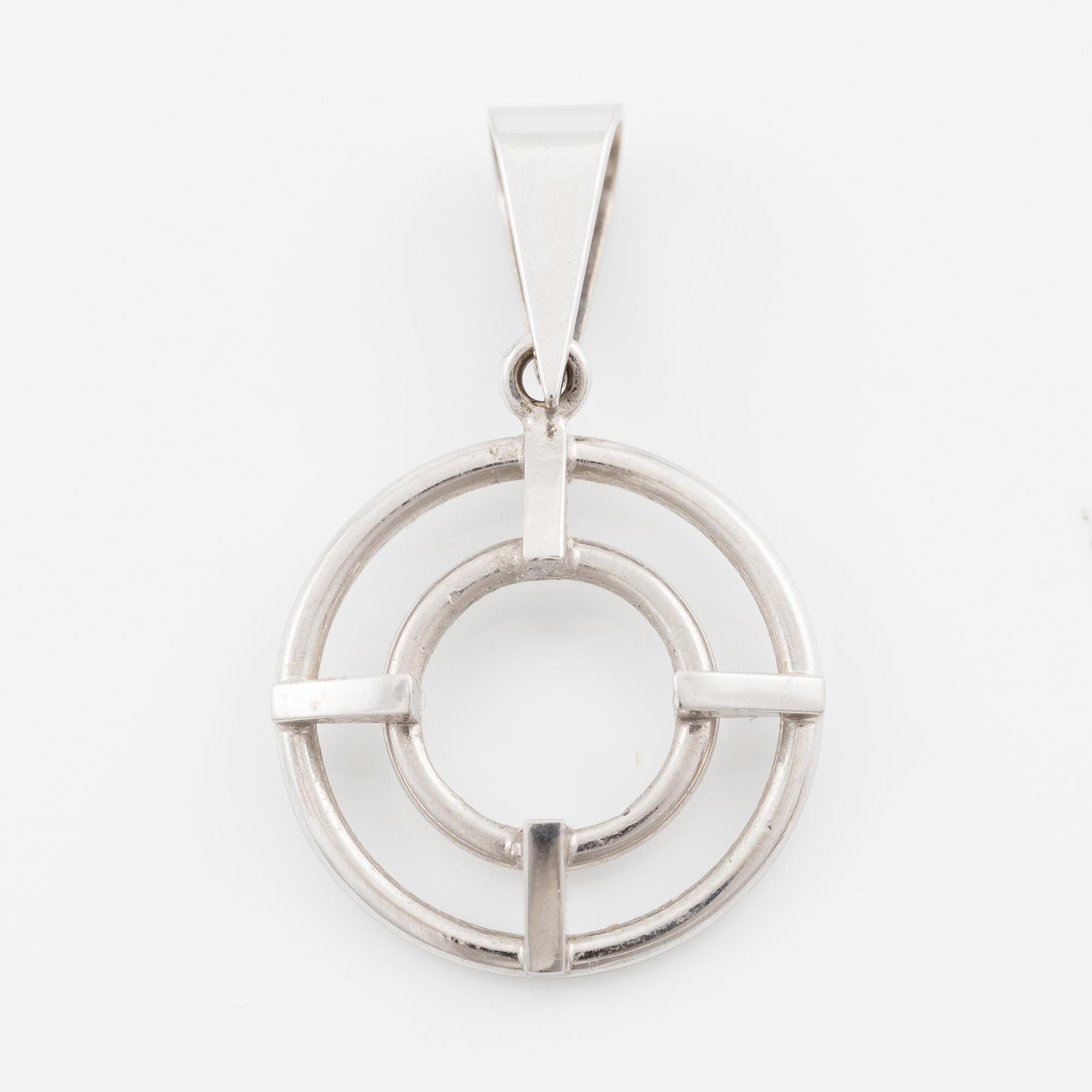 Brooch/pendant, 18K white gold with sapphire and brilliant-cut diamonds.