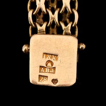 ARMBANDSUR, 18K guld, Marvin, 1900-talets mitt. Total vikt ca 26 g.