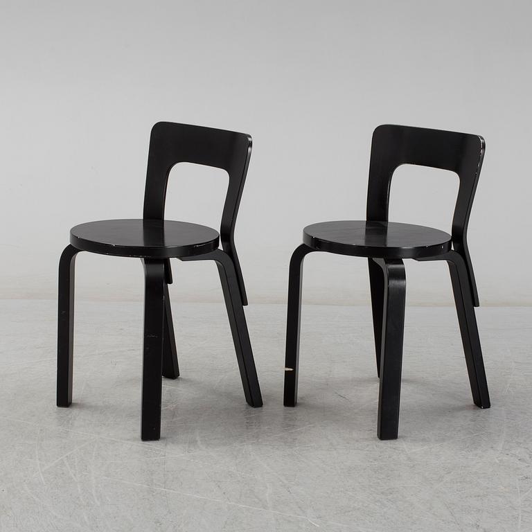 ALVAR AALTO, a pair of painted model 65 chairs from Artek, Finland.