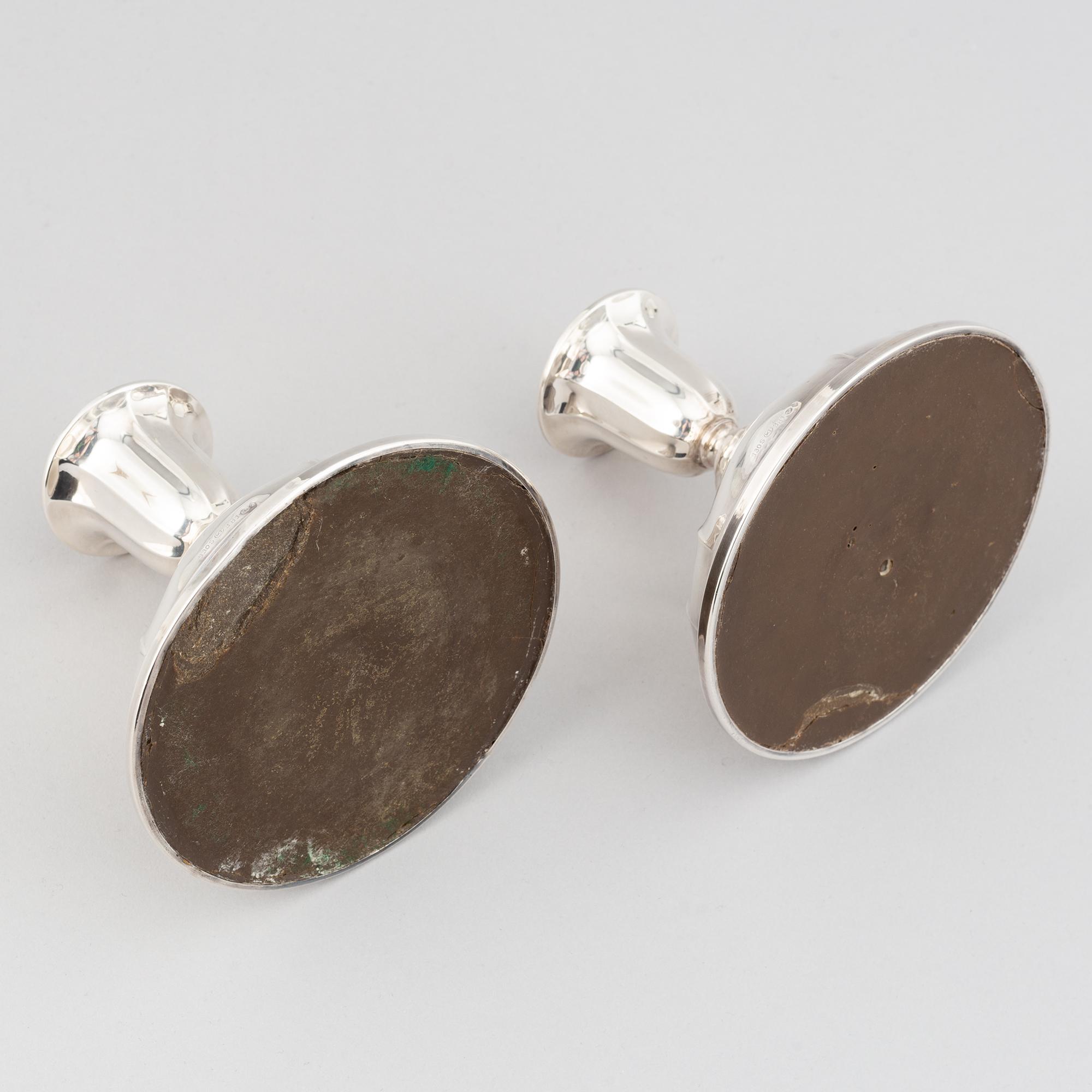 A pair of Norwegian silver candle sticks, mid 20th century.