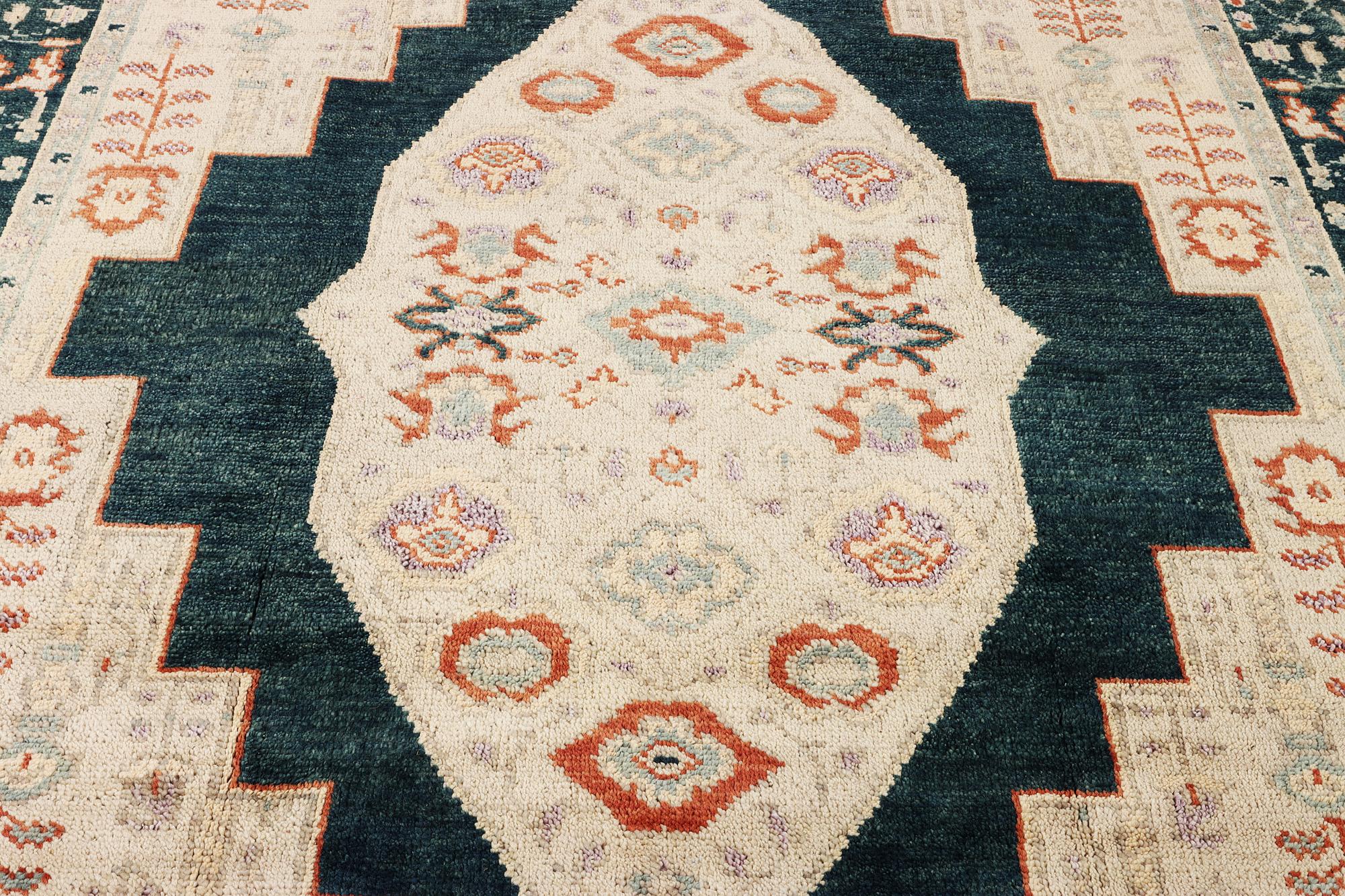 An oriental carpet with Mamluk design, c. 307 x 237 cm.