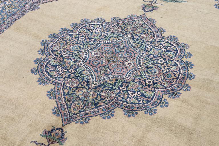 A semi-antique Kerman carpet, figural, c. 371 x 285 cm.