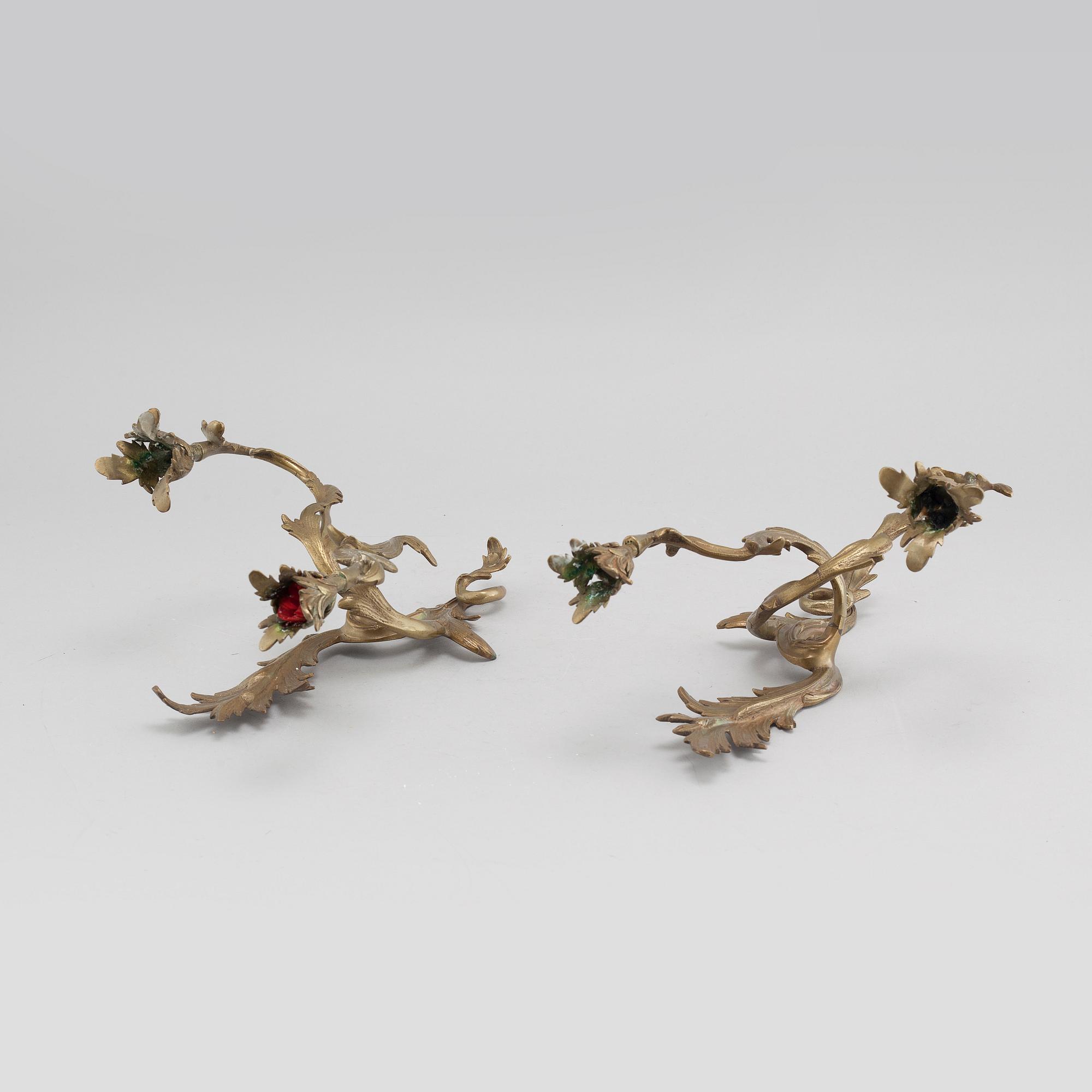 A pair of Louis XV-style brass wall sconces first half of the 20th century.