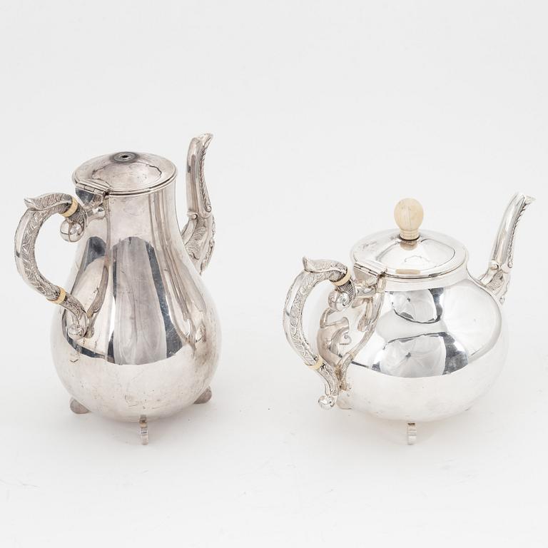 A sterling silver coffee pot, teapot, creamer and sugar bowl.