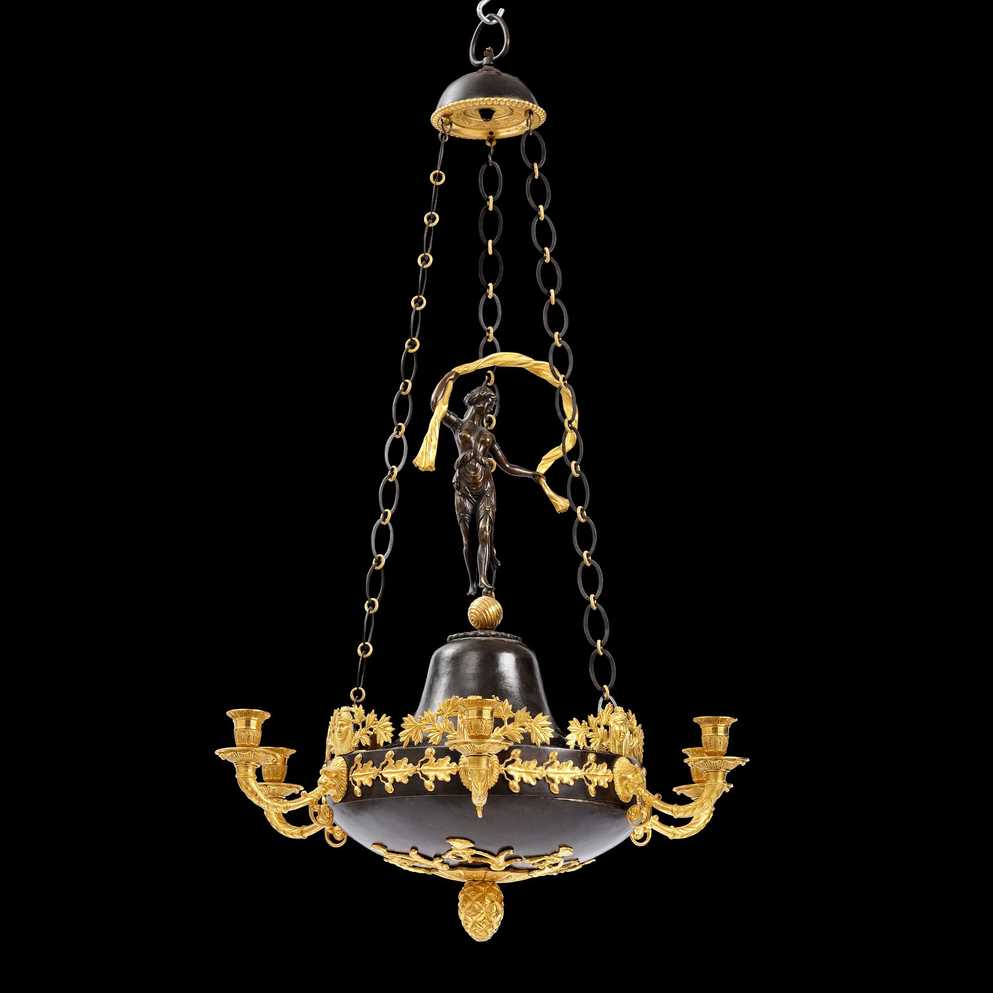 A patinated and ormolu six-light Empire chandelier, Stockholm, first part 19th century.