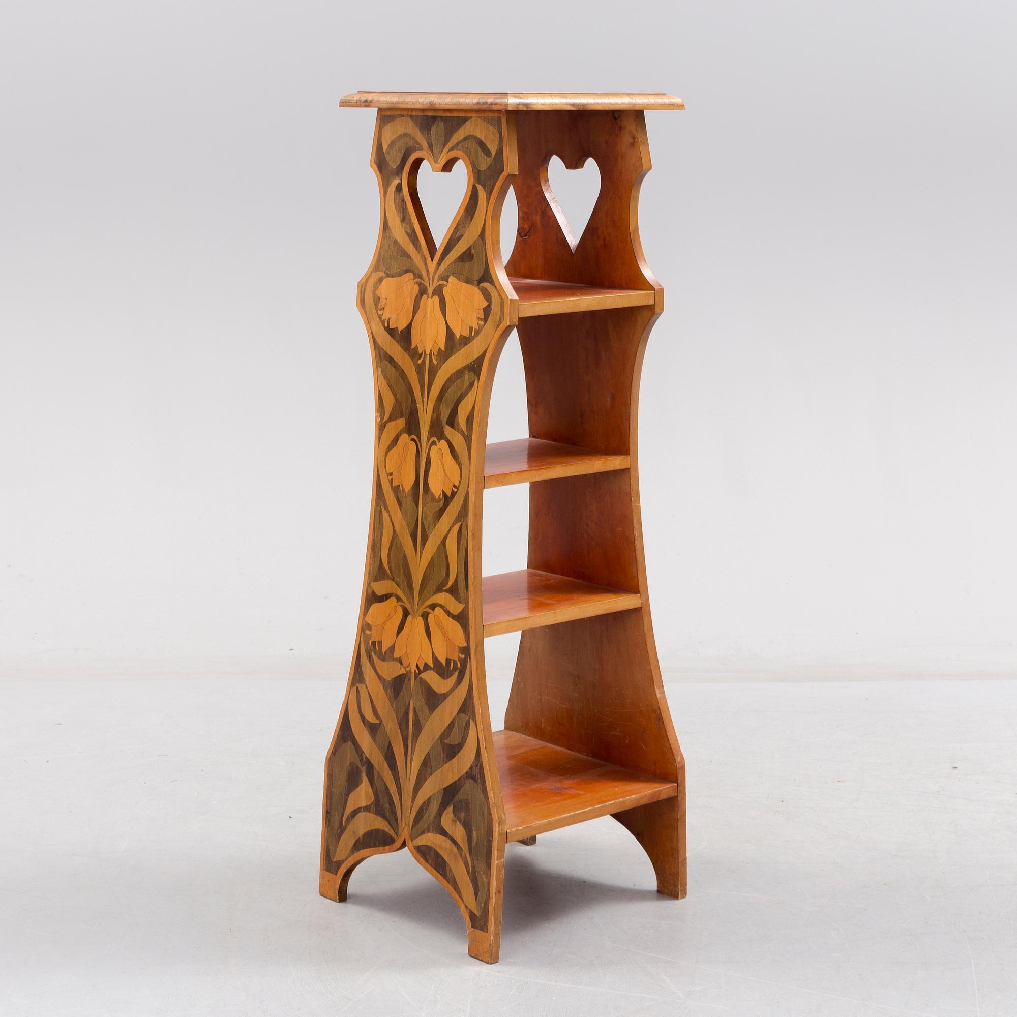 An early 20th century art nouveau shelf.