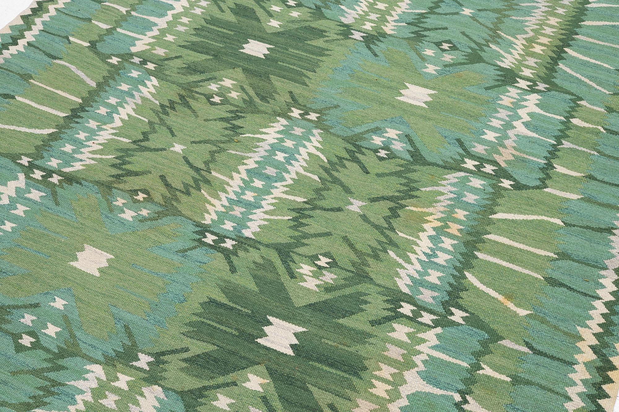 Barbro Nilsson, a carpet, 'Strålblomman grön', tapestry weave, c. 316 x 232 cm, signed AB MMF BN.