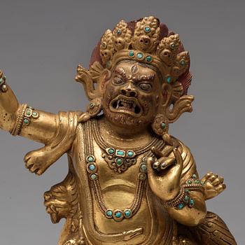 A Sinotibetan gilt bronze figure of Vajrapani, possibly 17/18th Century.