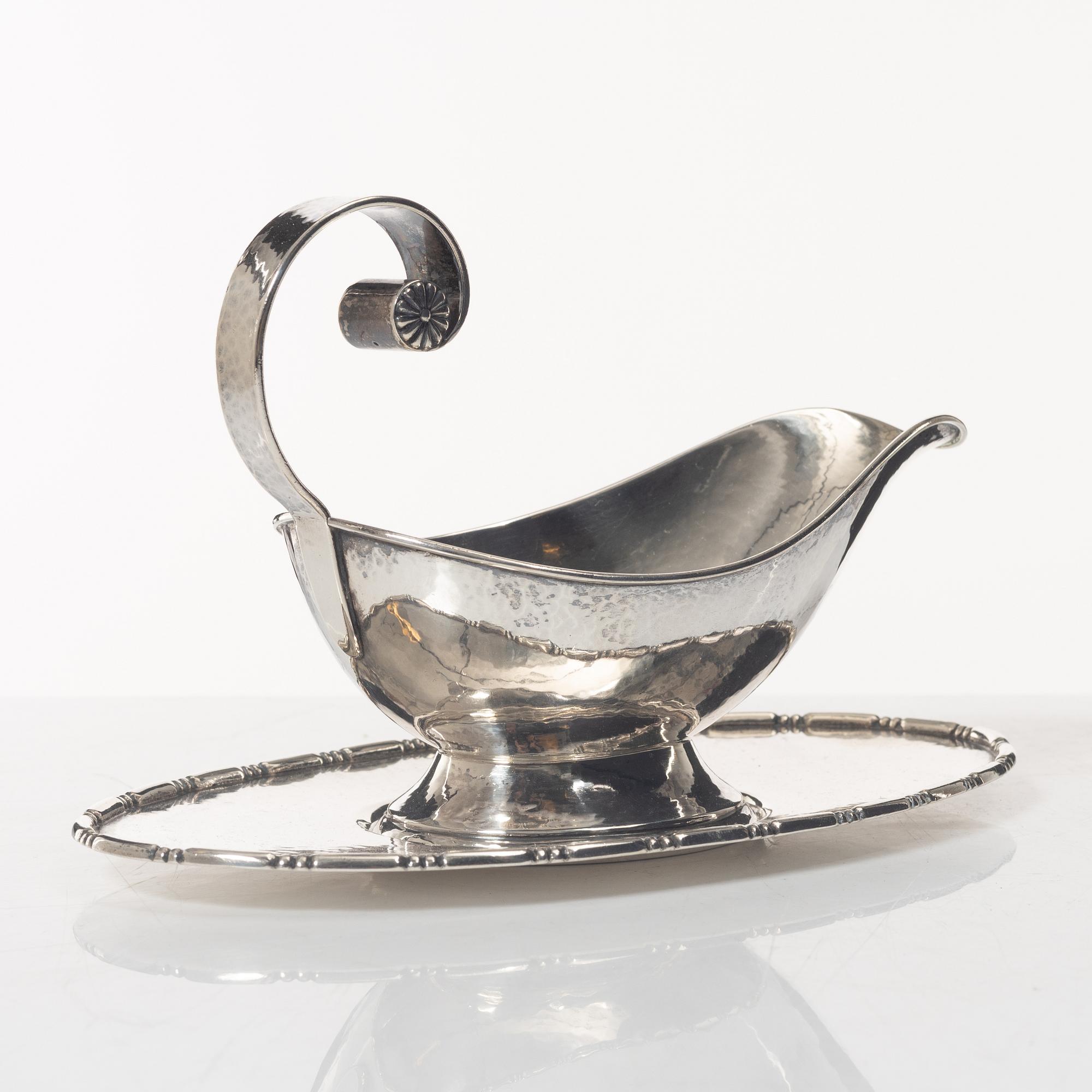A Swedish silver sauce boat, marks of C.G. Hallberg, Stockholm 1926.