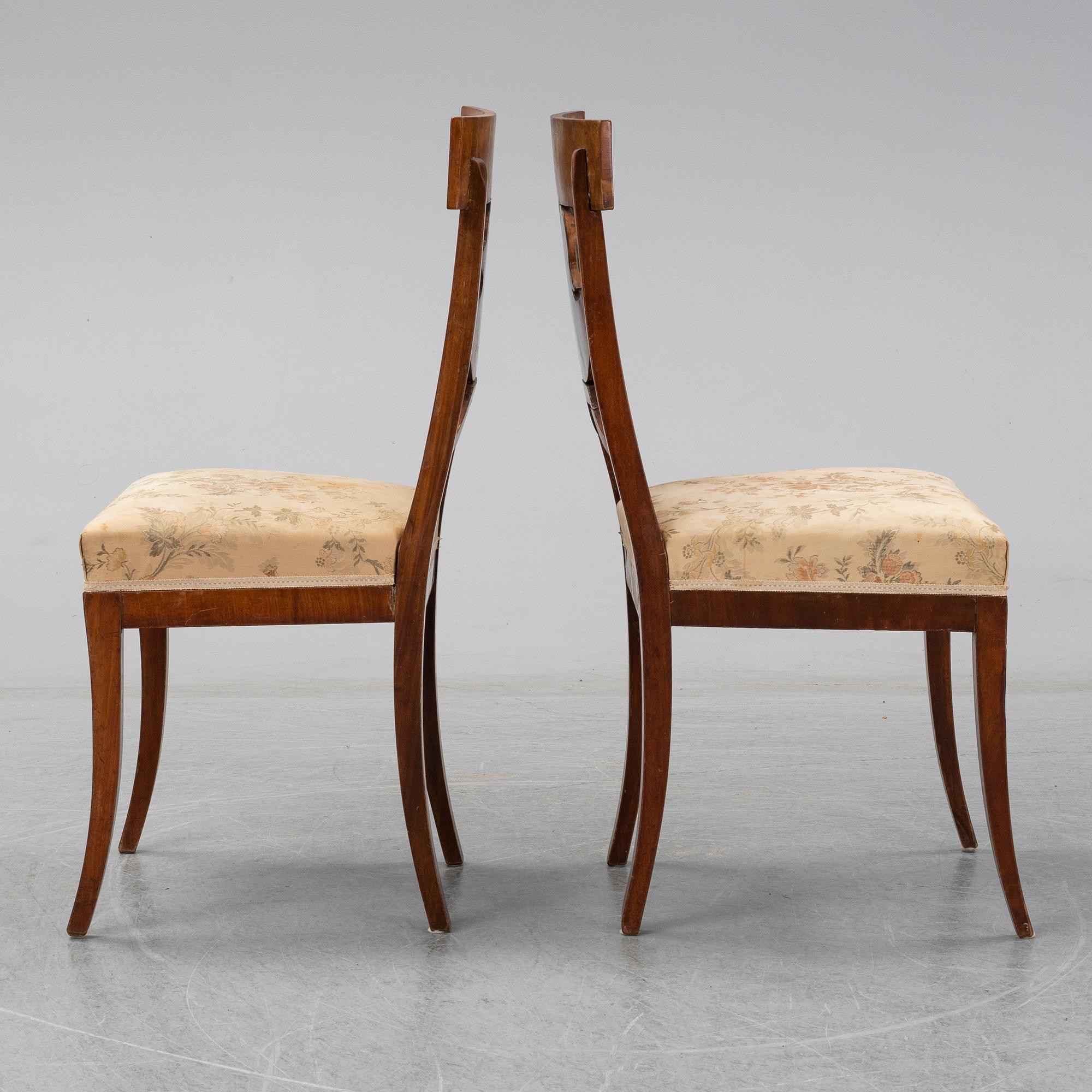 A pair of Royal Empire chairs, first half of the 19th Century.