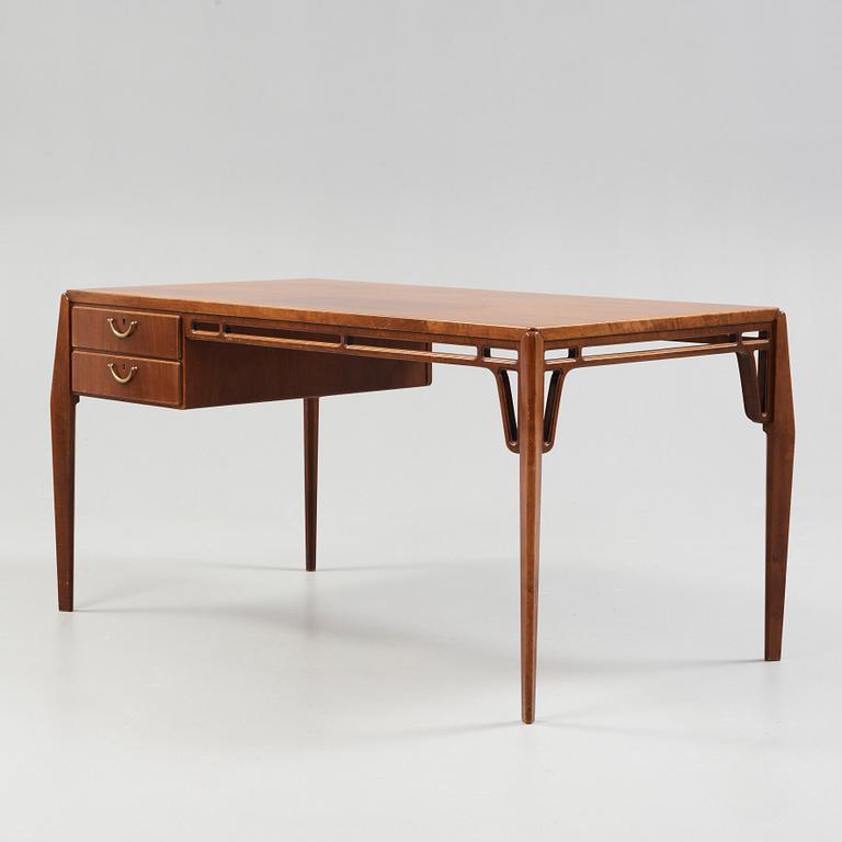 A Carl-Axel Acking Swedish Modern mahogany desk, Nordiska Kompaniet, 1950's.