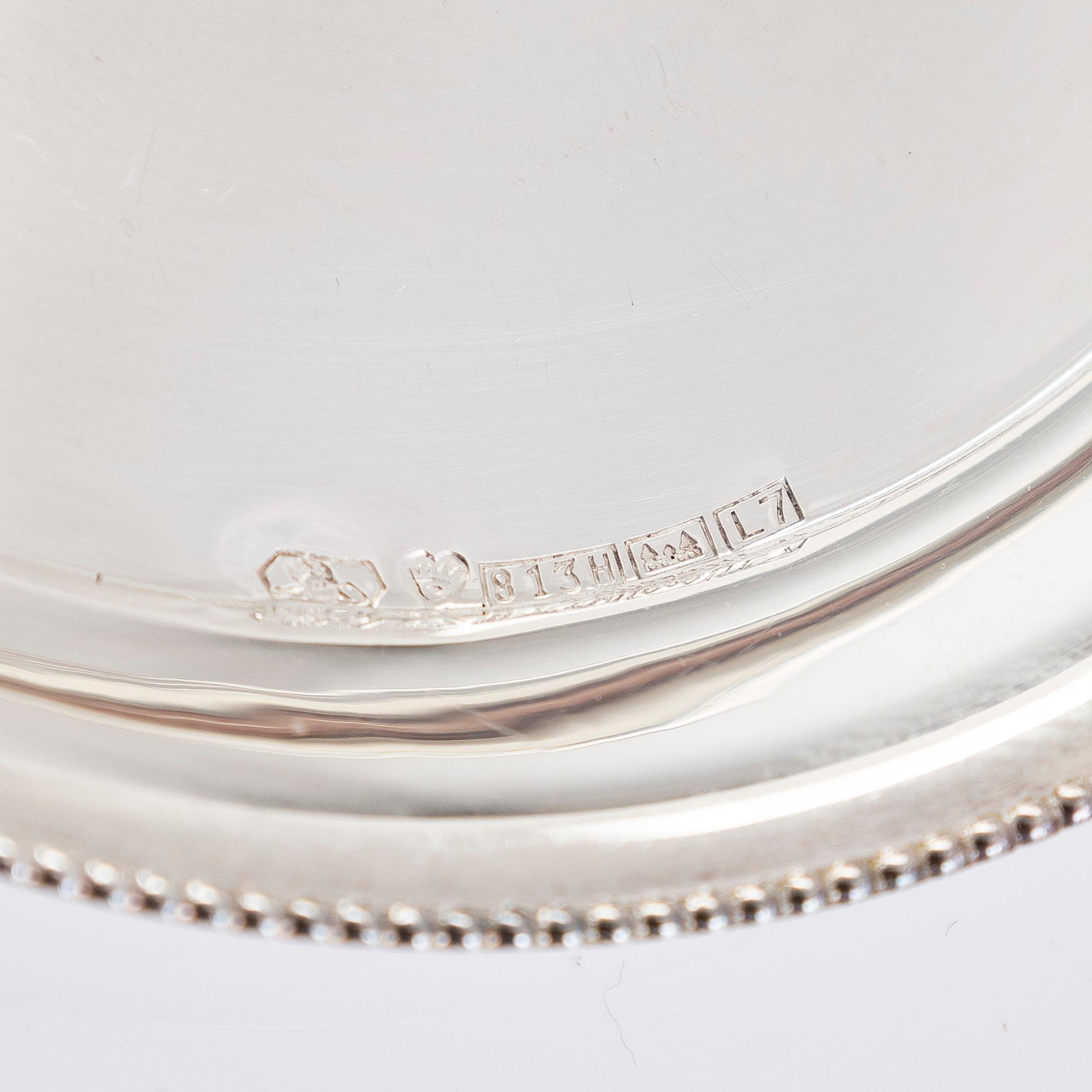 A 21-piece set of 'Chippendale' silver cutlery, and 11 silver coaster, Turku and Hämeenlinna, 1983-90 and 1964.