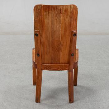 Axel Einar Hjorth, a pair of stained pine "Lovö" chairs, Nordiska Kompaniet, Sweden 1930's.