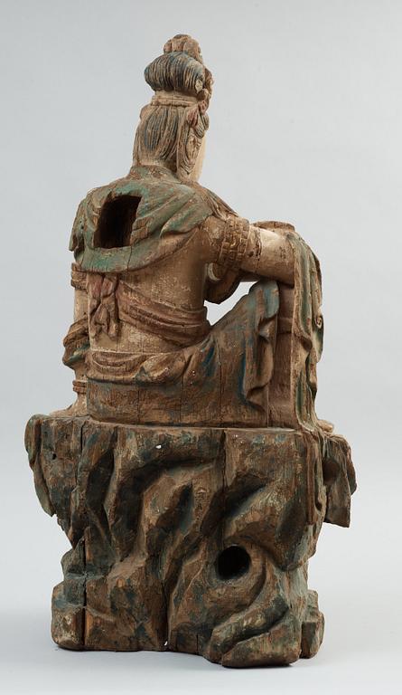 A seated wooden figure of Guanyin, presumably Ming dynasty (1368-1644).