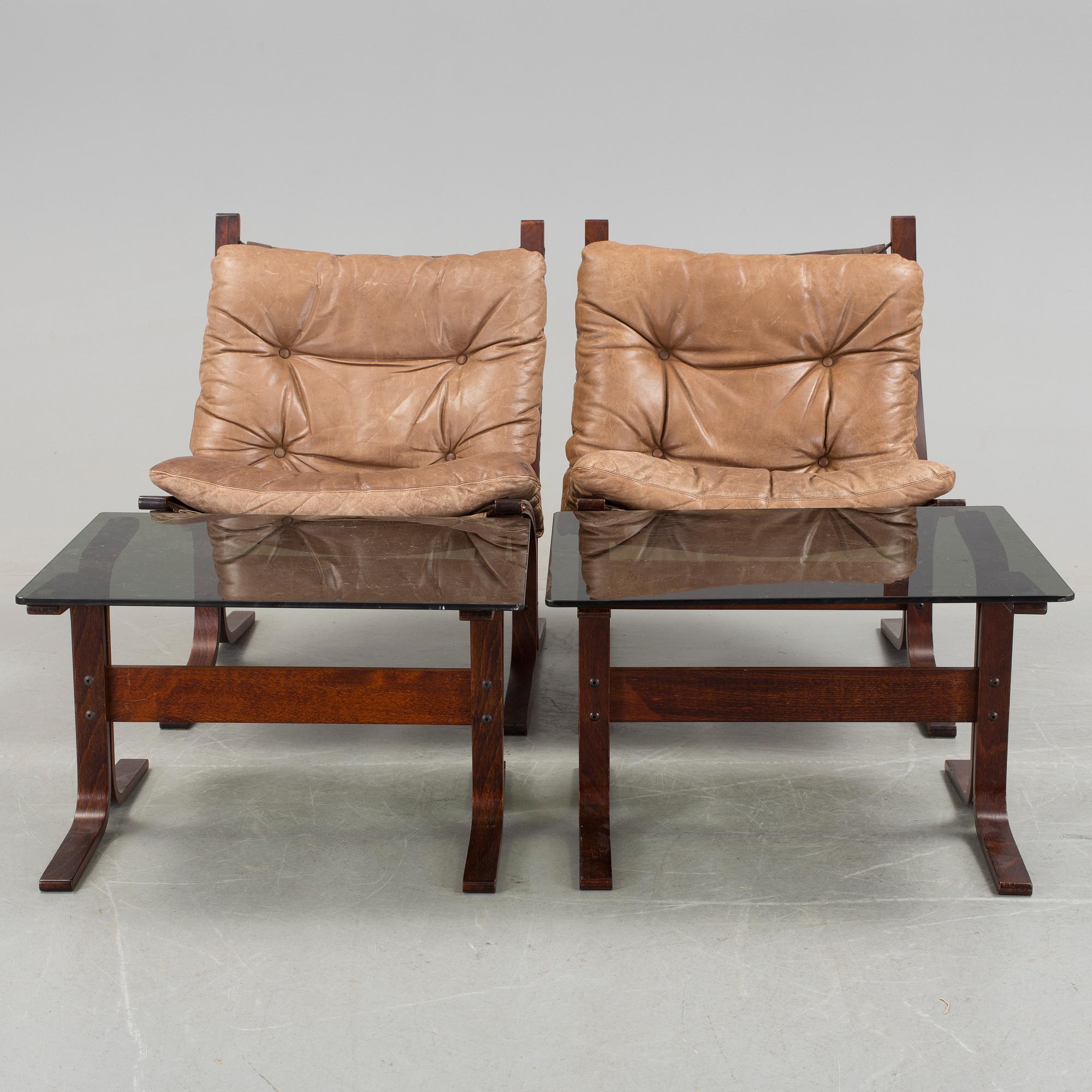 A pair of 1970s "Siesta", easy chairs and sofa tables by Ingmar Relling, Norge.